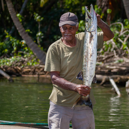 The villagers are tightly connected to their river, Sittee River. A fisherman showed us his catch of the day, a barracuda.